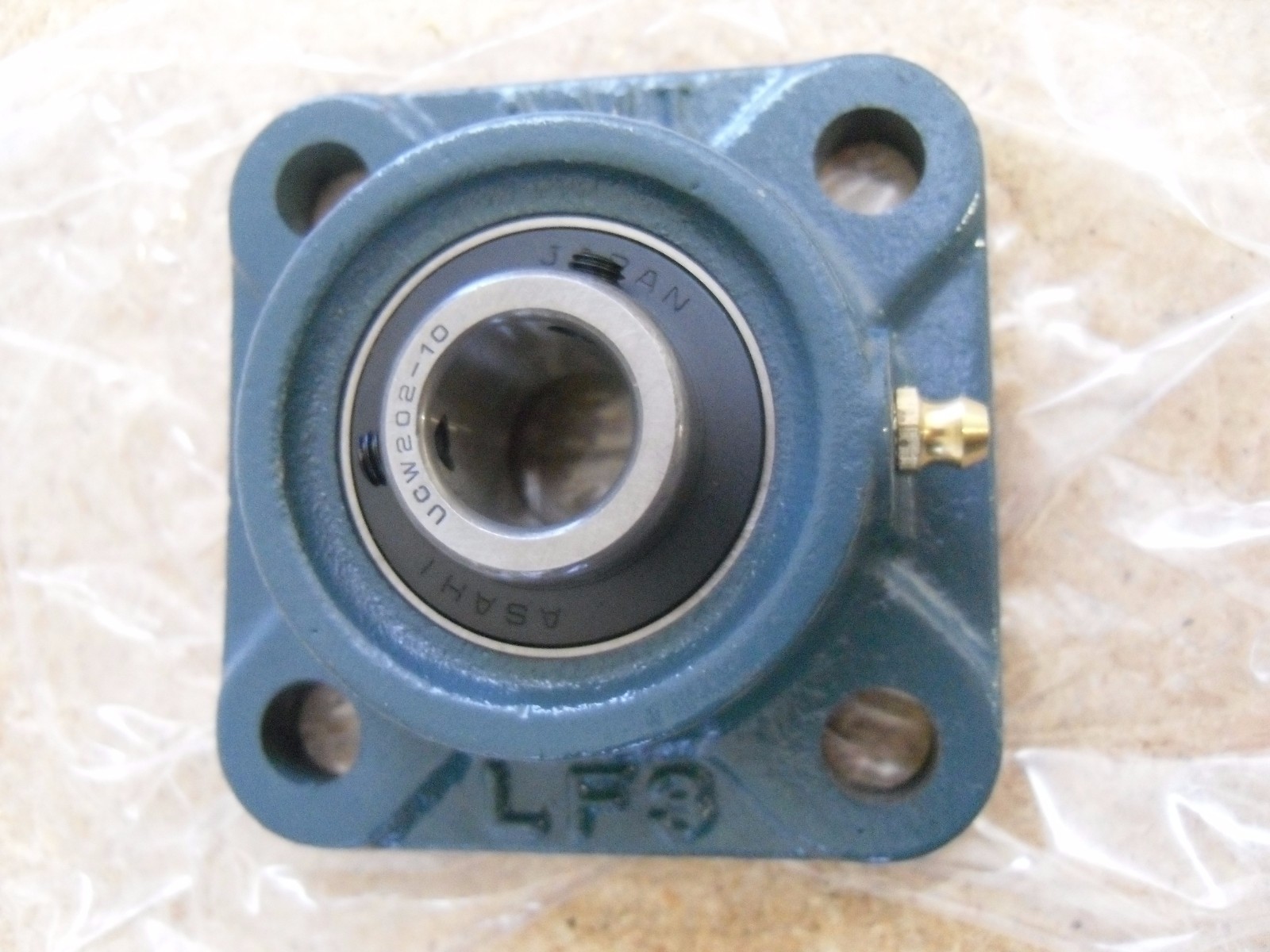 AMI UCLF202-10, Set Screw Locking Four-Bolt Flange Unit New Made In Japan