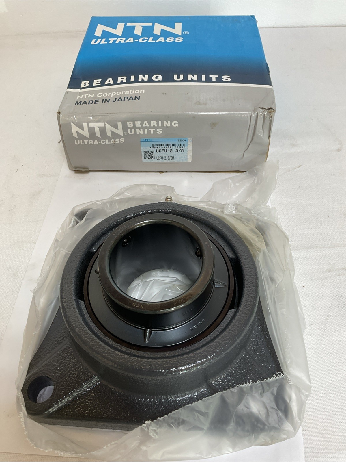 New In Box; NTN UCFU-2.3/8 Flange Bearing; 2-3/8″ID; 4-Bolt Mount