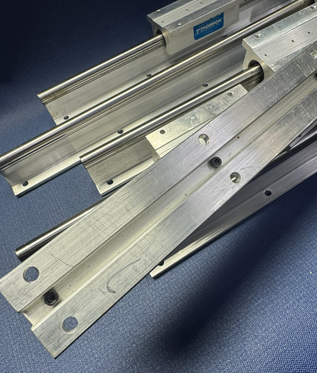 Lot of 6 – Thomson TWN8-OPN Linear Bearings on 17″ Rails